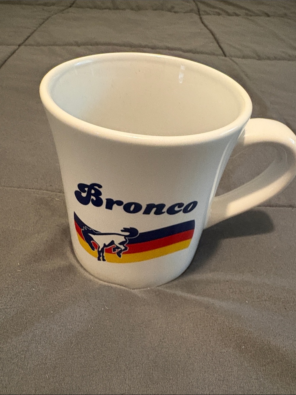 Open Road Brands White Bronco Mug with Blue, Red, and Yellow Stripes